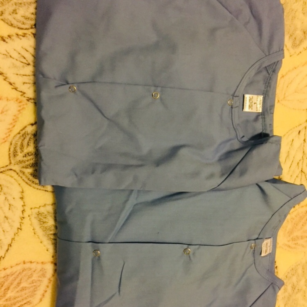 Two brand new with tag scrub jackets long sleeve